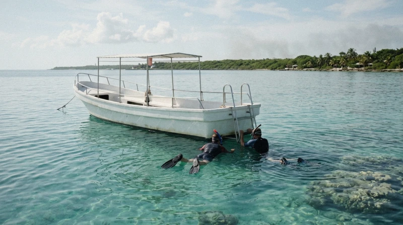 Guide and snorkelers above a shallow coral reef on a guided Cozumel boat tour by glass-bottom boat